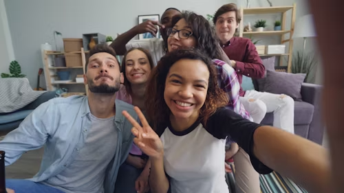 A lively group of friends taking a selfie, symbolizing vibrant community interaction.