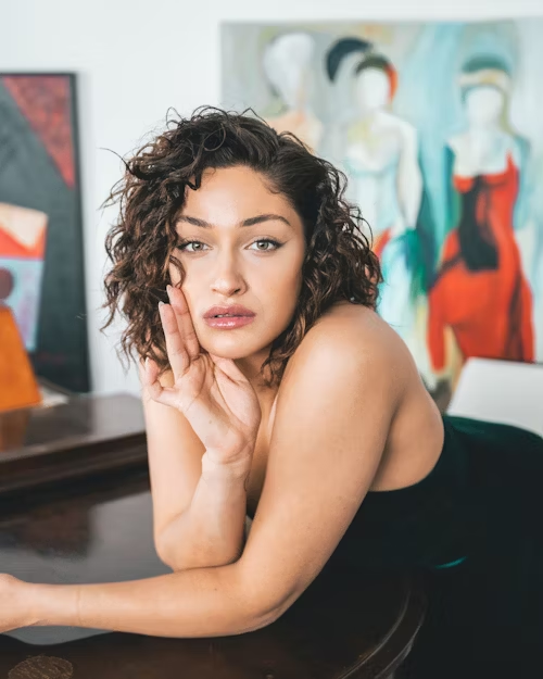 A woman with a seductive gaze, representing allure and temptation.