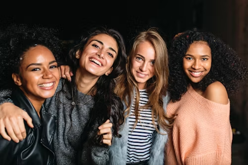 A group of smiling women, representing a vibrant and engaged community.